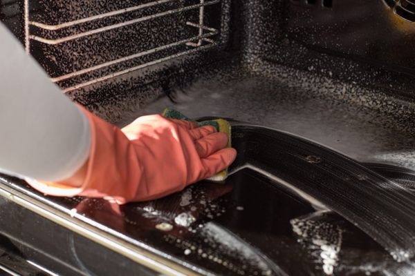 Oven being scrubbed in colchester